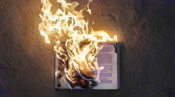 Photograph of an open book on fire
