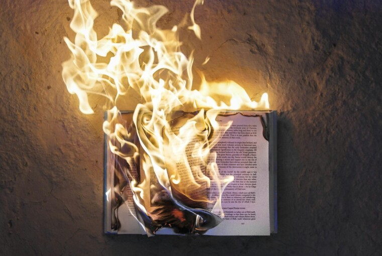 Photograph of an open book on fire