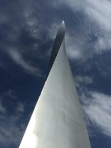 Photograph of a twisted metal spire reaching toward the sky
